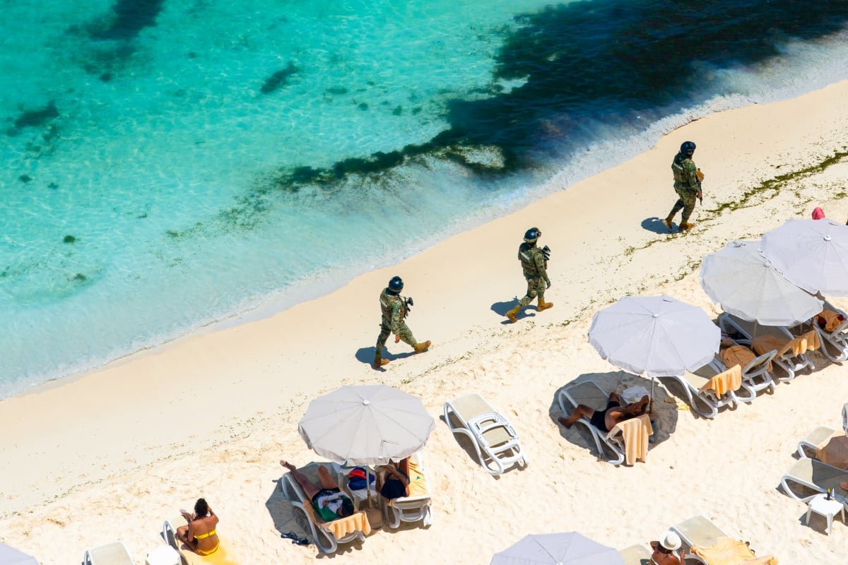 Marina soldiers of Mexican army patrolling beach in Cancun